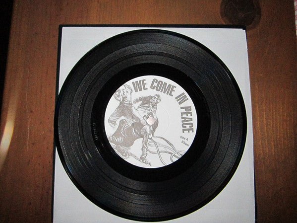 USED: Various - We Come In Peace (More World, Less Bank! Pt.2) (7") - Used - Used