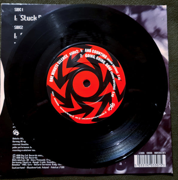 One Minute Silence : Stuck Between A Rock And A White Face  (7", Single)